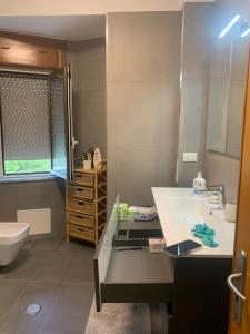 a bathroom with a sink and a toilet at Appartamento 300m dal mare AMANTEA CALABRIA in Amantea