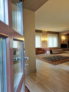 a living room with a couch and a living room at Villa Sarchi in Grantola