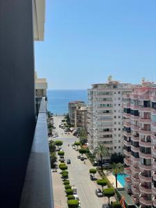 a view of a city street with buildings and the ocean at SA Apartments! 1bd Flat 300m to the Beach in Alanya