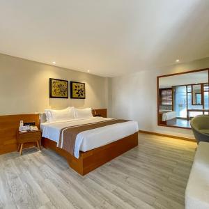 Giường trong phòng chung tại G Mekong Hotel Phom Penh