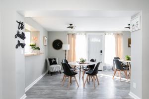 a dining room with a table and chairs at Perfect Sprawling Ranch for Group Game Day Stay! King Beds, Firepit, & Pet Friendly with Huge Fenced Yard in South Bend