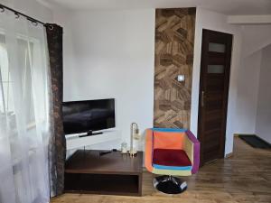 Televizors / izklaižu centrs naktsmītnē Willa Olivia