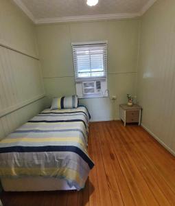 Postel nebo postele na pokoji v ubytování Cute Cottage