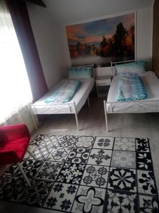 Postel nebo postele na pokoji v ubytování Direkt am See Ferienwohnungen
