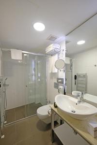 a bathroom with a toilet and a sink and a shower at Cheya Beşiktaş Istanbul Bosphorus City Center Hotel & Suites in Istanbul +69 photos