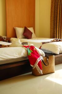 Postel nebo postele na pokoji v ubytování Khaolak Orchid Beach Resort - SHA Extra Plus