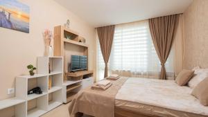 TV a/nebo společenská místnost v ubytování Lazur Delight