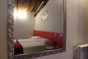 Posteľ alebo postele v izbe v ubytovaní B&B Podere Lambure- società agricola