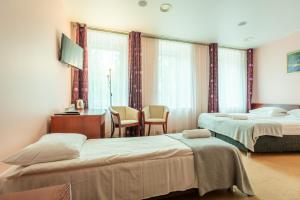 Postel nebo postele na pokoji v ubytování Hotel Medūna