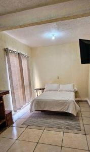 Ένα ή περισσότερα κρεβάτια σε δωμάτιο στο Casa Limón