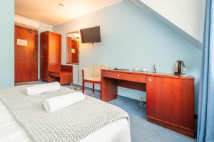 TV a/nebo společenská místnost v ubytování Hotel Medūna
