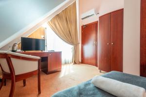 TV a/nebo společenská místnost v ubytování Hotel Medūna