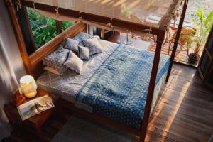 an overhead view of a bed with pillows and a window at Villa Fiesta - Beachfront Getaway in Verna