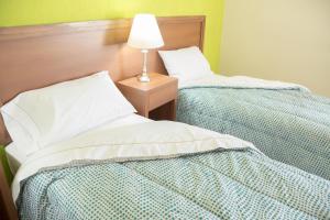 Una cama o camas en una habitación de Park View Hotel & Residences