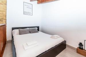 Ліжко або ліжка в номері GuestReady - Mezzanine comfort in Valencia