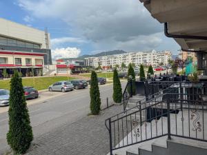 a view of a street with cars parked on the road at PARK INN in Lukavica