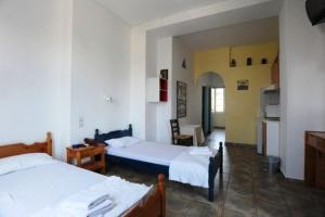 Ένα ή περισσότερα κρεβάτια σε δωμάτιο στο Γαλήνη Χώρα Τήνου