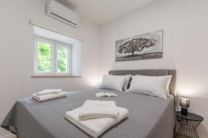 Voodi või voodid majutusasutuse San Salvatore Sweet Apartments toas