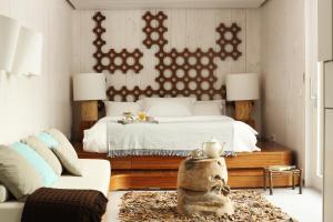 En eller flere senger på et rom på Casas Do Coro