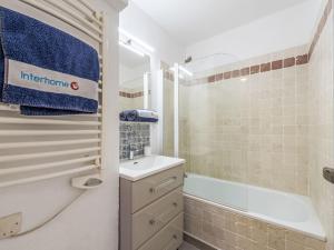 a bathroom with a shower and a sink and a tub at Apartment Caesar Domus-1 by Interhome in Saint-Tropez