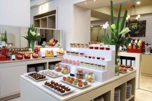 a bakery with many different types of food on display at NH Collection Buenos Aires Lancaster in Buenos Aires