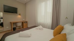Voodi või voodid majutusasutuse Manere Suites toas