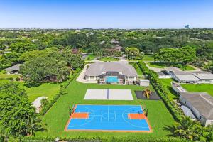 vista aerea di una tenuta con campo da tennis di Luxurious Estate 8BR w Heated POOL & GAMEROOM a Davie