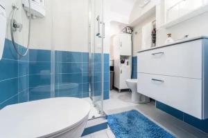 a bathroom with a shower and a toilet and a sink at Charming House in Castellammare del Golfo with Balcony in Castellammare del Golfo
