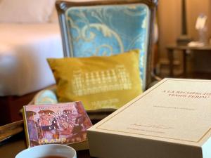 a table with a box on top of a table at Le Grand Hotel de Cabourg - MGallery Collection in Cabourg