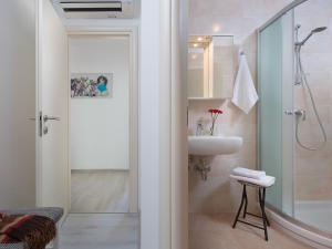 a bathroom with a shower and a sink at Holiday Home Ana by Interhome in Trget +18 photos