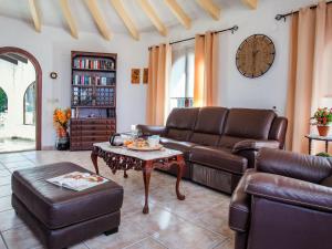 a living room with a couch and a table at Holiday Home Bizet by Interhome in Jávea