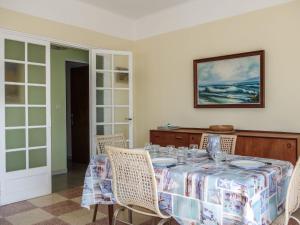 a dining room with a table and chairs at Apartment Les Trois A by Interhome in Saint-Cyr-sur-Mer