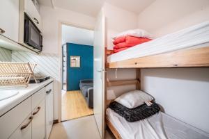 En eller flere senge i et værelse på Le Cozy Tétras