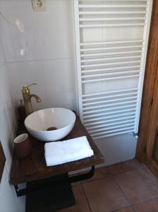 a bathroom with a white sink and a shower at CASA ABUELo CAÑI in Arenas de San Pedro +16 photos
