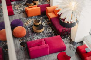 an overhead view of a living room with colorful furniture at Best Western Malmo Arena Hotel in Malmö