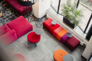 an overhead view of a living room with colorful furniture at Best Western Malmo Arena Hotel in Malmö