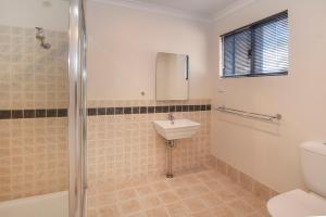 a bathroom with a toilet and a sink at Cape Illawarra Holiday House Margaret River in Margaret River Town +23 photos