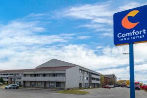 a sign for a comfort inn and suites at Comfort Inn & Suites North at the Pyramids in Indianapolis