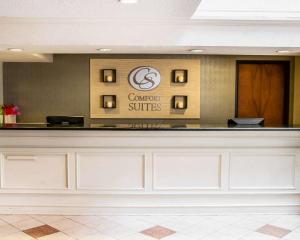 a lobby with a counter with a sign at Comfort Suites McAlester in McAlester