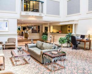 a large living room with a couch and tables at Comfort Suites McAlester in McAlester