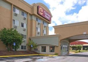 a hotel with a sign on the side of it at Clarion Inn Renton-Seattle in Renton