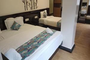 Hotel Ninamma客房内的一张或多张床位