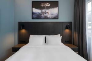 Postel nebo postele na pokoji v ubytování Radisson Blu 1919 Hotel, Reykjavík