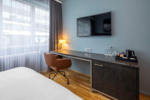 Postel nebo postele na pokoji v ubytování Radisson Blu 1919 Hotel, Reykjavík