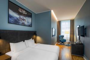 Postel nebo postele na pokoji v ubytování Radisson Blu 1919 Hotel, Reykjavík