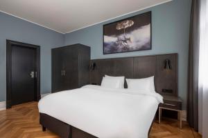 Postel nebo postele na pokoji v ubytování Radisson Blu 1919 Hotel, Reykjavík