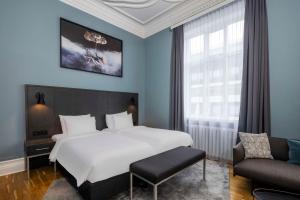 Postel nebo postele na pokoji v ubytování Radisson Blu 1919 Hotel, Reykjavík