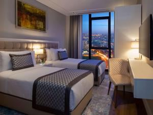 Postel nebo postele na pokoji v ubytování Movenpick Living Istanbul West