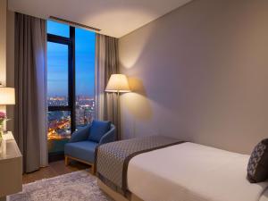 Postel nebo postele na pokoji v ubytování Movenpick Living Istanbul West