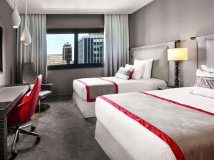 Mövenpick Hotel Abidjan客房内的一张或多张床位